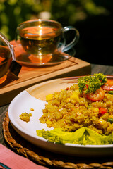 Delicious Seafood Fried Rice with Herbal Tea in Outdoor Setting