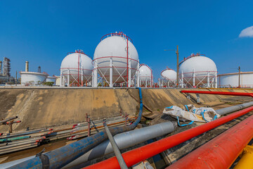 White spherical propane tanks containing
