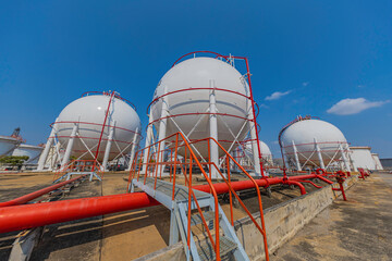 White spherical propane tanks containing