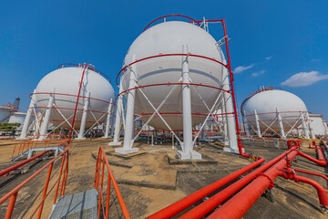 White spherical propane tanks containing