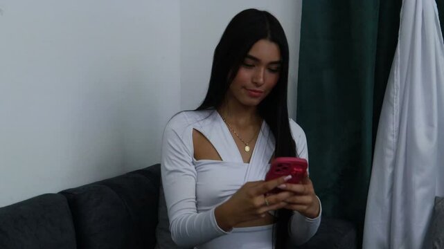 Video of a young woman chatting in the comfort of home