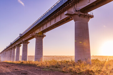 bridge over the river at sunset