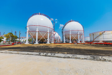 White spherical propane tanks containing