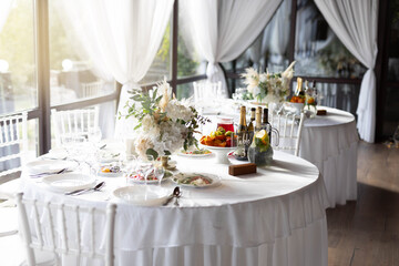 beautiful set of plates with kitchen utensils with food on white tablecloth
