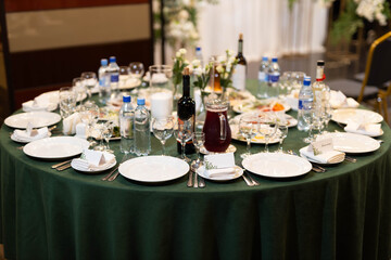 beautiful set of plates with kitchen utensils with food on white tablecloth