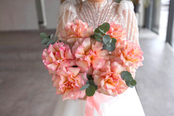 beautiful white wedding bouquet in the bride's hand	