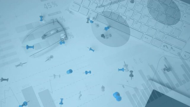Keyboard with data charts and scattered pushpins creating animation on desk