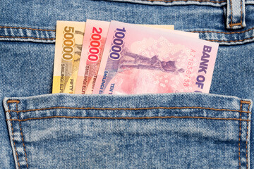 Ugandan shiling in the pocket of blue jeans