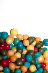 Close up of round ball sugar ice cream cake decorations on a white background