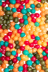 Obraz premium Close up of round ball sugar ice cream cake decorations on a white background