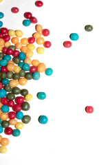 Close up of round ball sugar ice cream cake decorations on a white background