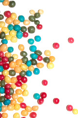 Close up of round ball sugar ice cream cake decorations on a white background