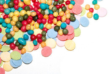 Close up of sprinkles sugar balls and chocolate cake ice cream decoration strands on white background
