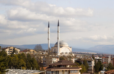 Naklejka premium On the horizon, a mosque with two minarets, along with other buildings