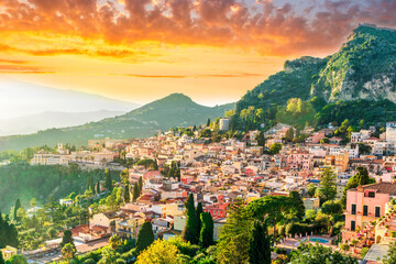 panoramic view of beautiful sunset in old european town with vintage buildings and great mountains with amazing evening sky un background