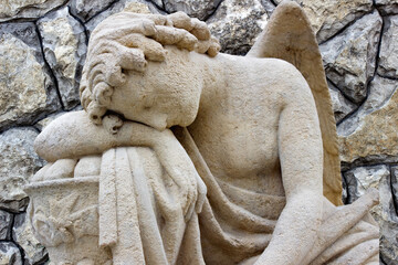 A tired lonely angel rests after a heavenly battle