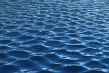 Fototapeta premium a close up of a blue water surface with ripples