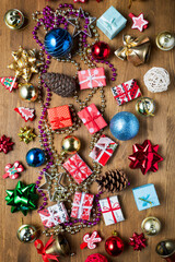 Christmas tree decorations on wooden background, top view