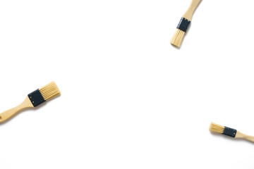 Paint brushes on a white empty background, abstraction