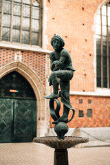 Sculpture of a man in a hat in Krakow, Poland