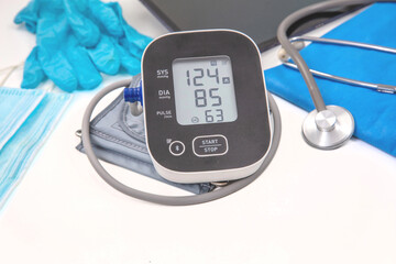 Healthcare, medical doctor equipment on white, blood pressure monitor