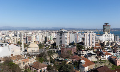 Obraz premium Beautiful coastline of the Albanian town. Scenic view of modern coastal city Durres from mountain view point.