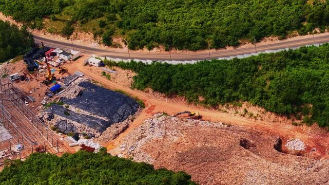 Aerial view Landfill garbage dump site in island of Thailand. Concept Asia ecological problem of plastic pollution.