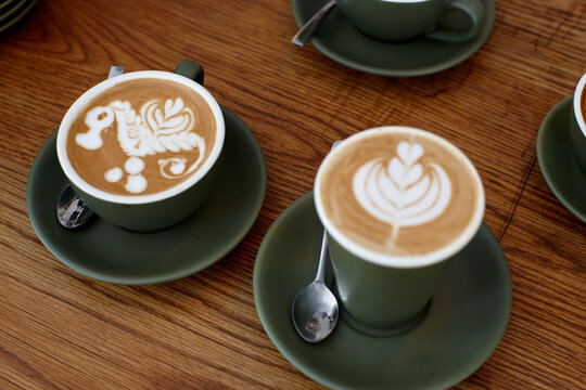 Coffee with froth decoration served on table
