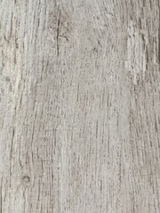 Obraz premium Detailed view of a weathered wooden surface, accentuating the wood's unique lines and subtle color variations.