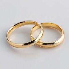 Elegant Gold Wedding Rings on Soft White Background
