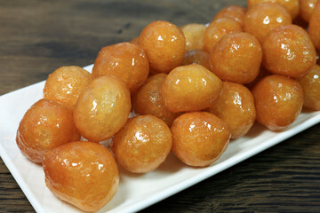 Lokma Tatlısı Traditional Turkish dessert Lokma on rustic wood