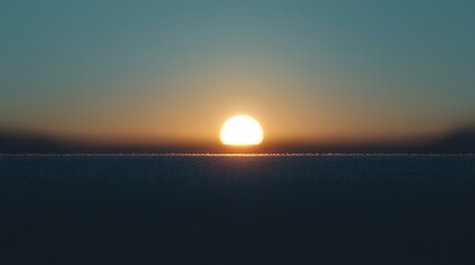 Bright Sun Setting Over a Frozen Landscape