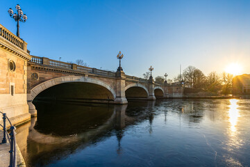 Hamburg, Germany. Frozen Inner Alster Lake (German: Binnenalster) downtown with historic bridge Lombardsbrücke.