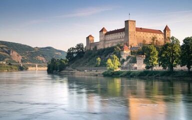 Fototapeta premium Danube River, Morning light on a riverfront castle