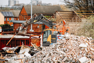 Construction machinery operates at a demolition site 