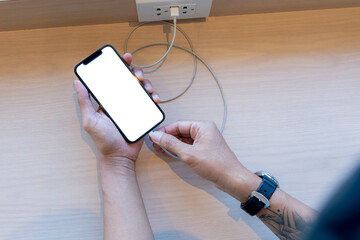 Smart phone charging,plugged into electrical outlet