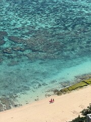 Aerial view of turquoise waters and coral beach in Uluwatu, Bali