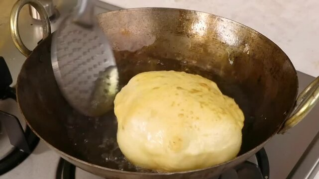 Chole Bhature &ndash; A famous North Indian street food with spicy chickpea curry (Chole) and crispy deep-fried bread (Bhature). Indians favorite, loved in restaurants, homes, and street food stalls.