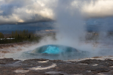 Iceland – Geysir Erupting at Dusk: A Majestic Display of Nature's Power