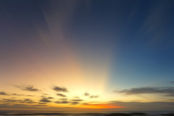 Sunrise over the sea. Light of the beautiful sunset over horizon in the beach with colorful sky. Sunset sunrise sky background. Sky clouds backgrounds. Morning light at sunrise.