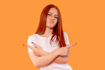 Young woman confidently posing against a bright orange background showcasing a fun and playful...