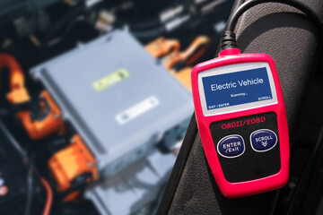 OBD-II Scanner displaying electric vehicle data scanning process , Car code reader scan tool , Car repair concept