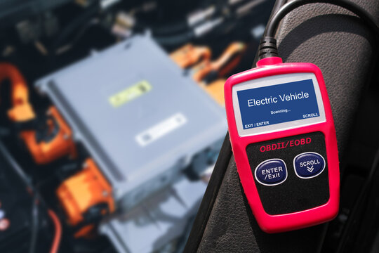 OBD-II Scanner displaying electric vehicle data scanning process , Car code reader scan tool , Car repair concept