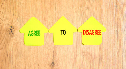 Agree to disagree symbol. Concept words Agree to disagree on beautiful yellow paper houses....