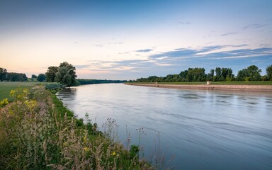 Danube River, Calm river at dawn, grassy bank, rural landscape