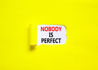 Nobody is perfect symbol. Concept words Nobody is perfect on beautiful white paper. Beautiful yellow paper background. Business motivational lifestyle and nobody is perfect concept. Copy space.
