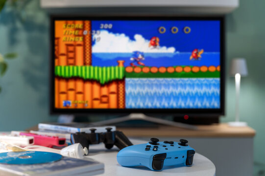 Modern Gamepad Playing Retro Sonic Videogame on Television