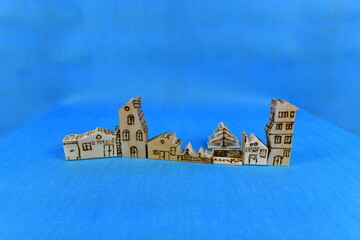Hand carved soft spruce wood play houses and tree decorated by burning.  The houses and tree were made by me.