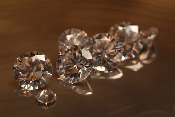 Beautiful shiny gemstones on golden tray, closeup