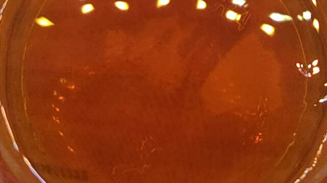 Pouring whiskey or rum in glass